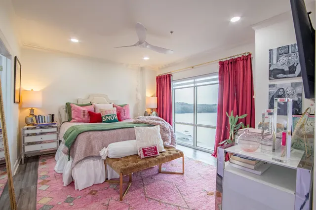 a bathroom with a tub sink toilet and window