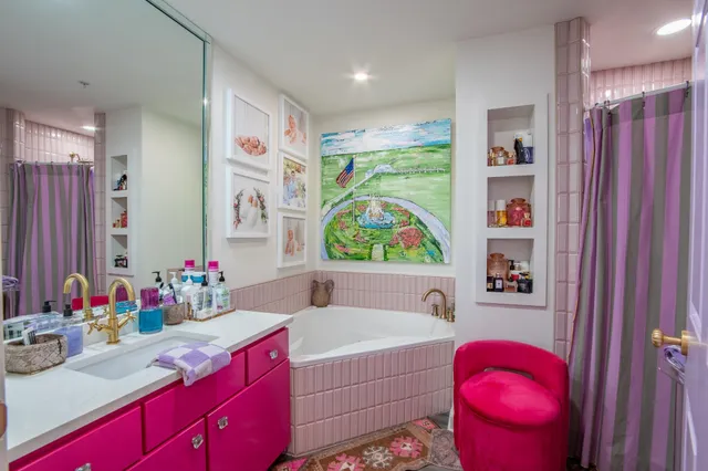 a bathroom with a bath tub sink and a toilet