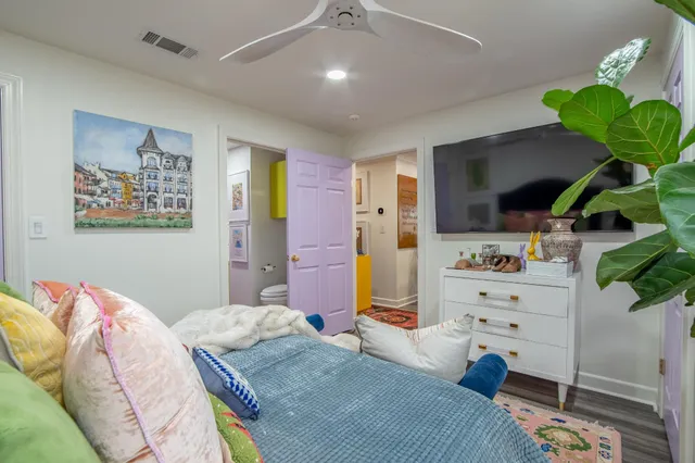 a view of a house with a wooden deck