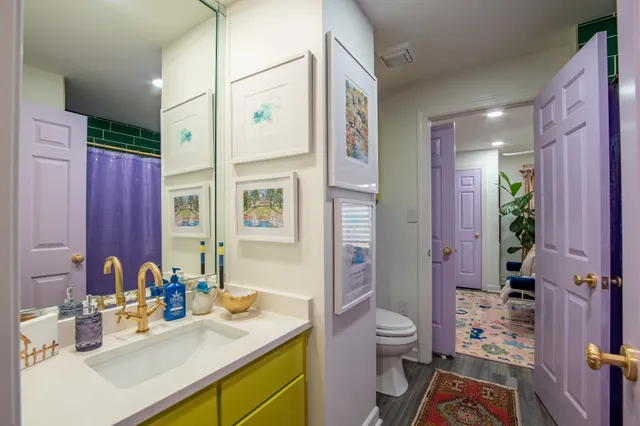 a view of a patio with table and chairs potted plants