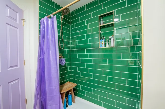 a roof deck view with a table and chairs