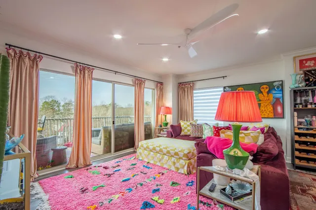 a bedroom with furniture and a flat screen tv