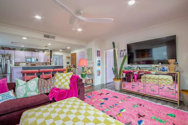 a kitchen with stainless steel appliances kitchen island granite countertop a refrigerator and a stove top oven