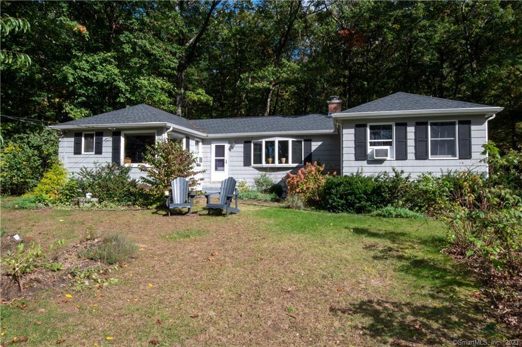 106 Notch Road Granby, CT 06035 - Photo 1 of 1 a front view of a house with yard and green space
