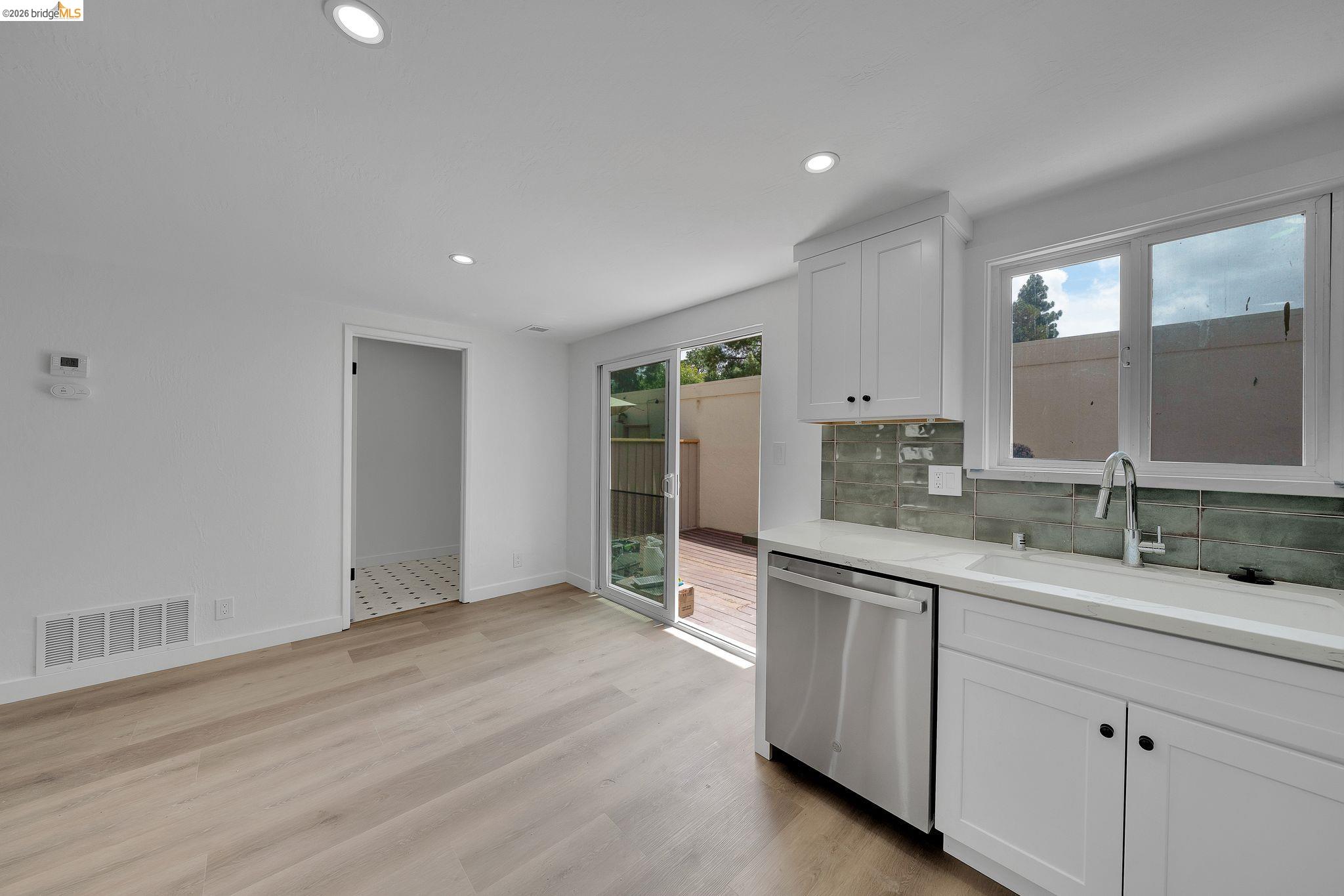 1808 Wildbrook Court, Unit D Concord, CA 94521 - Photo 19 of 47 a spacious bathroom with a granite countertop sink and a mirror