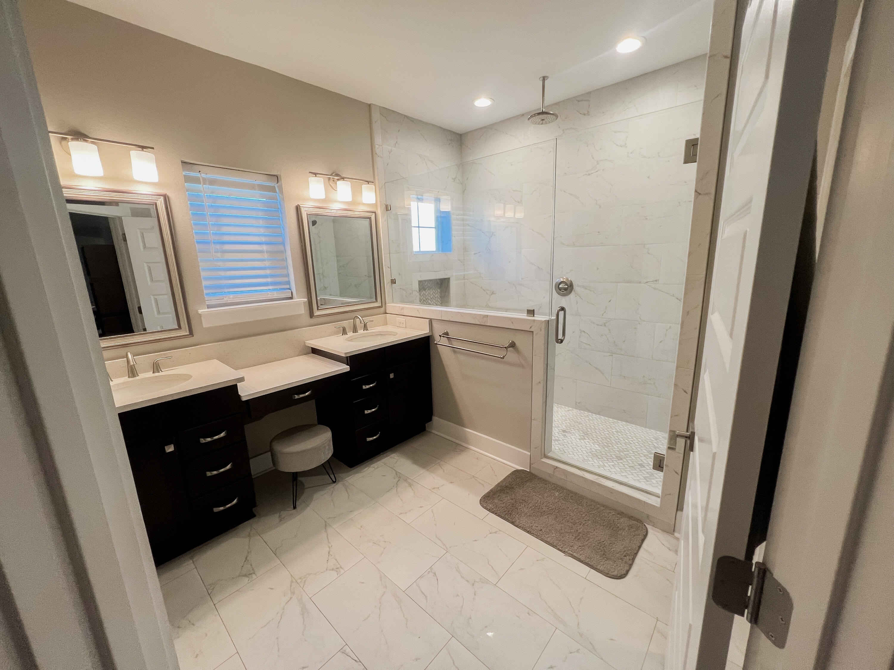 1159 Deer Moss Loop Niceville, FL 32578 - Photo 11 of 24 a spacious bathroom with a double vanity sink a mirror and a shower