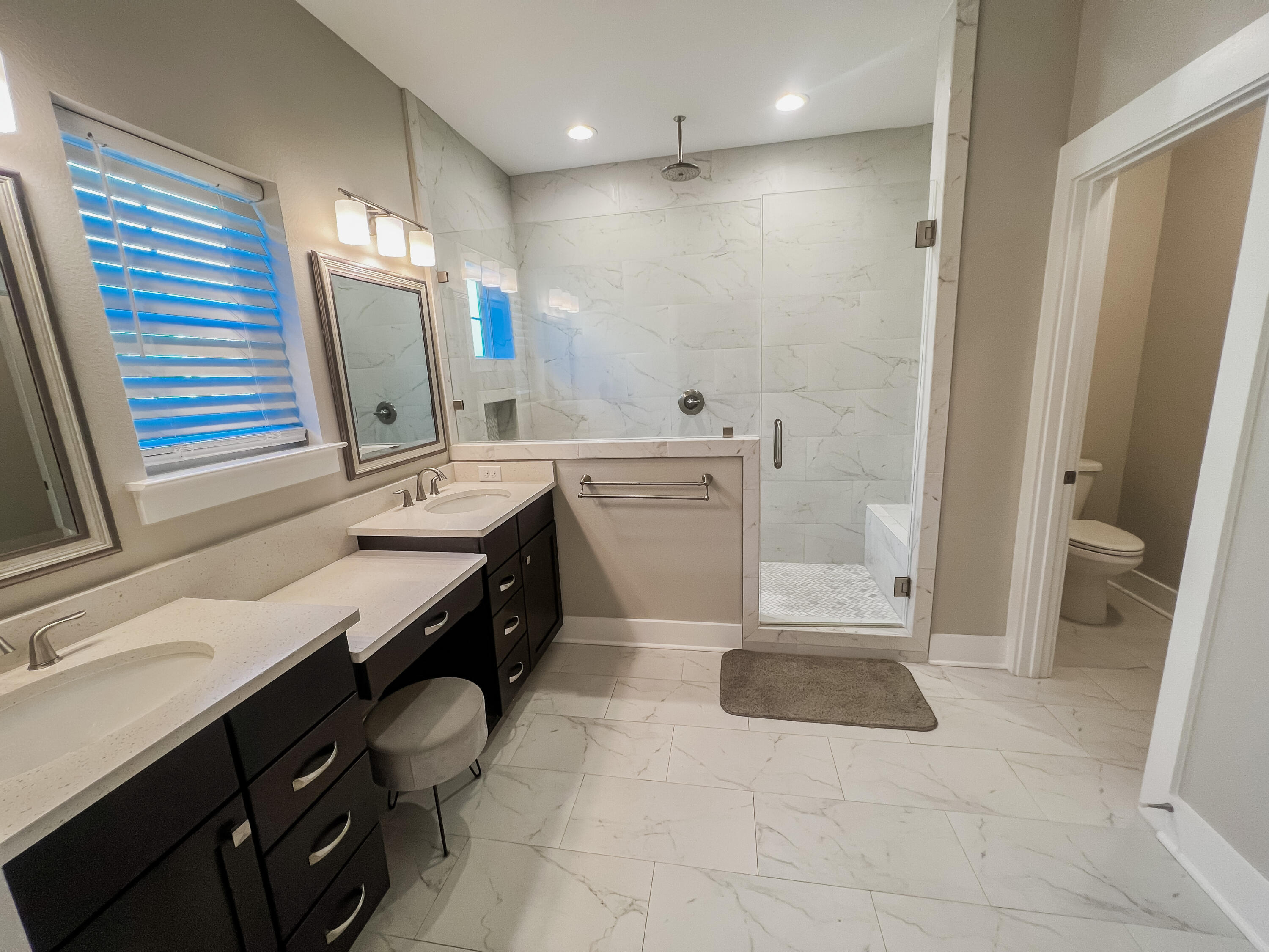 1159 Deer Moss Loop Niceville, FL 32578 - Photo 13 of 24 a spacious bathroom with a sink a vanity and a mirror