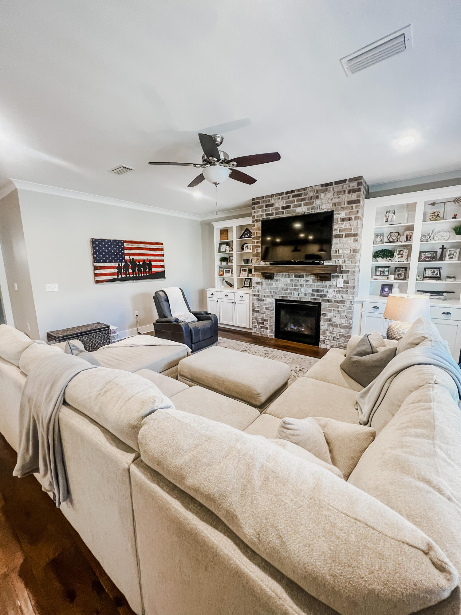 1159 Deer Moss Loop Niceville, FL 32578 - Photo 5 of 24 a bed room with a bed a fireplace and a television