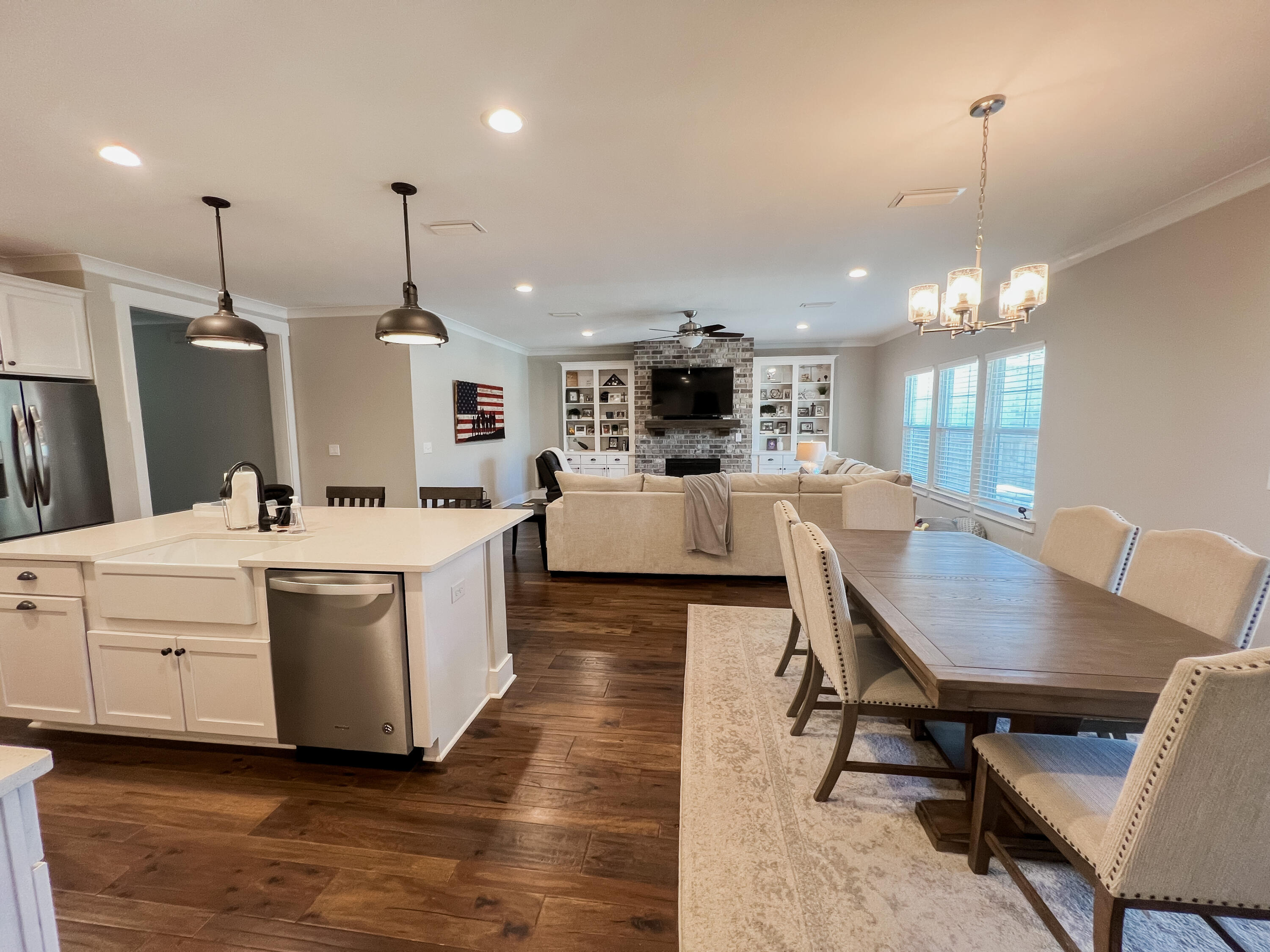 1159 Deer Moss Loop Niceville, FL 32578 - Photo 9 of 24 a large white kitchen with a table and chairs