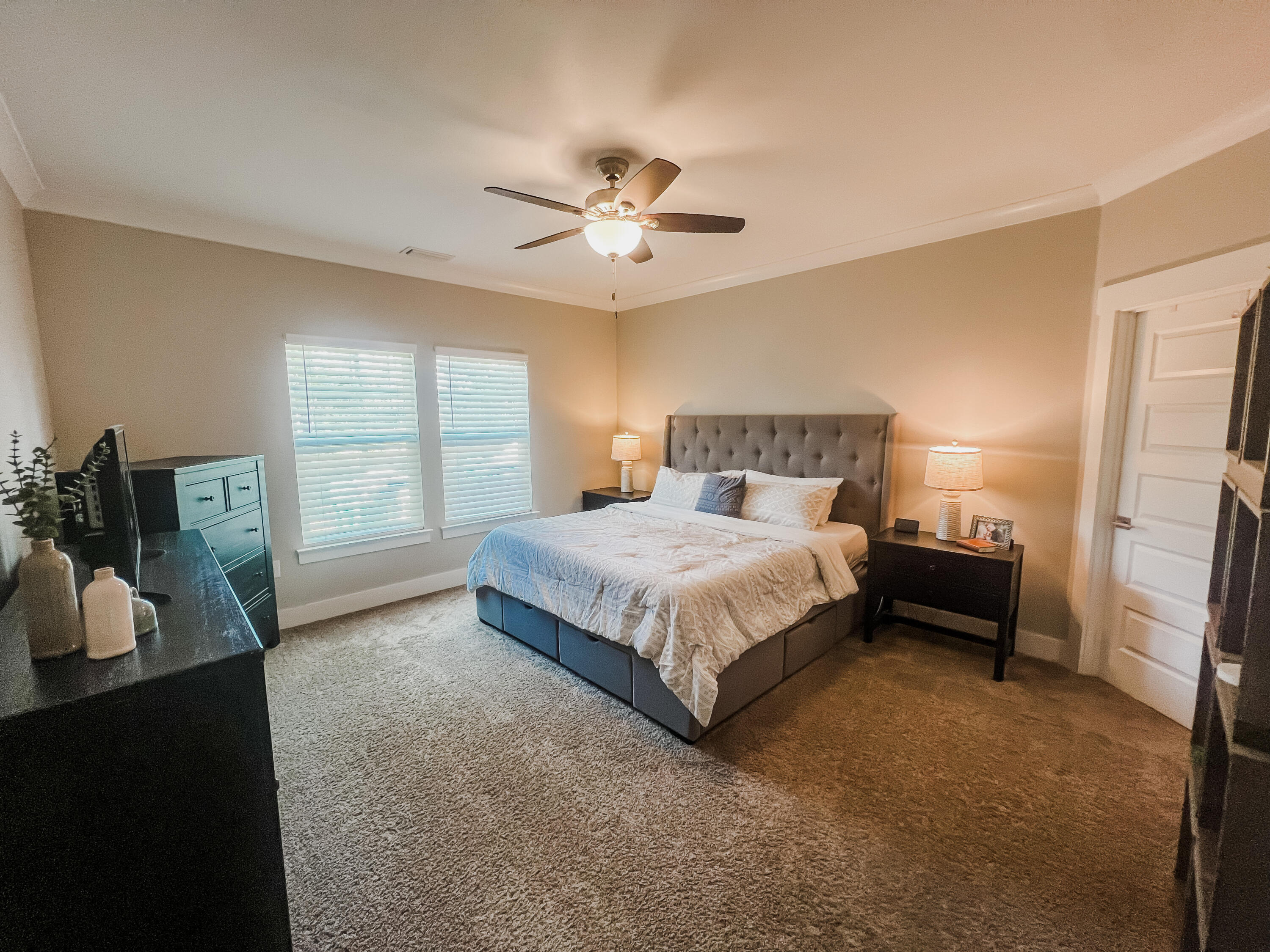 1159 Deer Moss Loop Niceville, FL 32578 - Photo 10 of 24 a bedroom with a bed and a large window