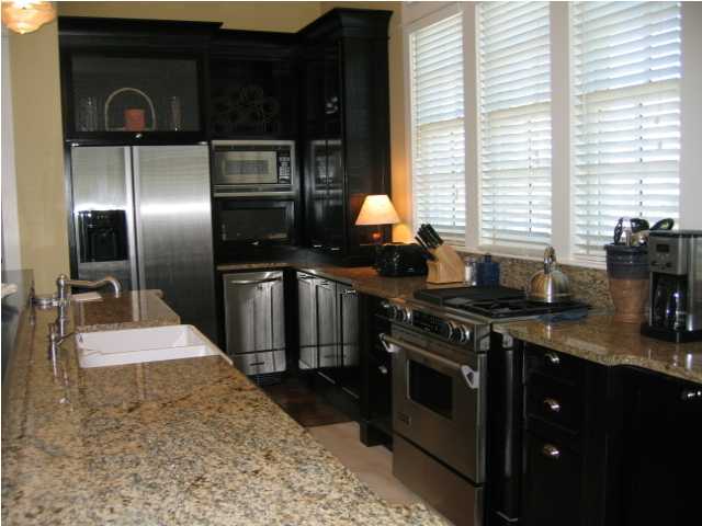 75 East Long Green Road Rosemary Beach, FL 32461 - Photo 3 of 12 a kitchen with stainless steel appliances granite countertop a stove a sink and a refrigerator