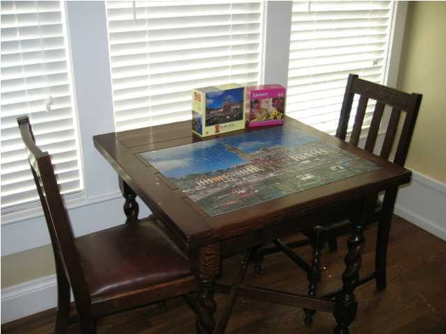 75 East Long Green Road Rosemary Beach, FL 32461 - Photo 5 of 12 a view of a dining room with furniture and wooden floor