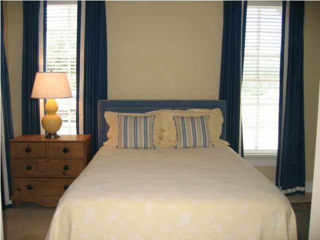75 East Long Green Road Rosemary Beach, FL 32461 - Photo 8 of 12 a large bed sitting in a bedroom next to a window