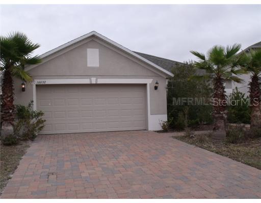 16632 Cedar Run Drive Orlando, FL 32828 - Photo 1 of 1 a front view of a house with garden