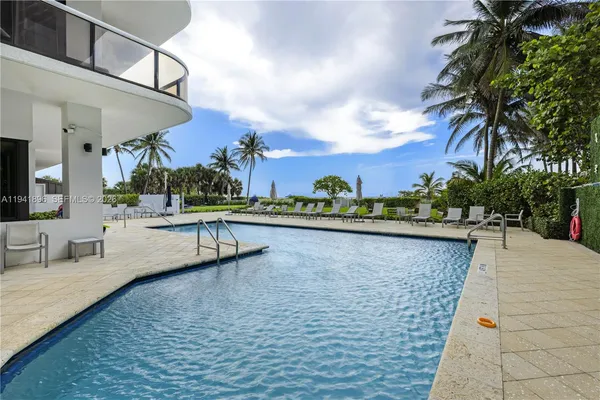 a view of a swimming pool with a patio