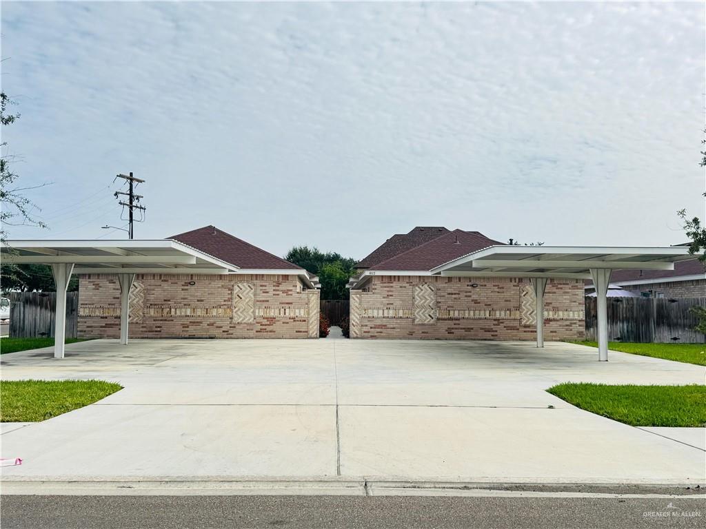 a view of a house with a garden and pathway