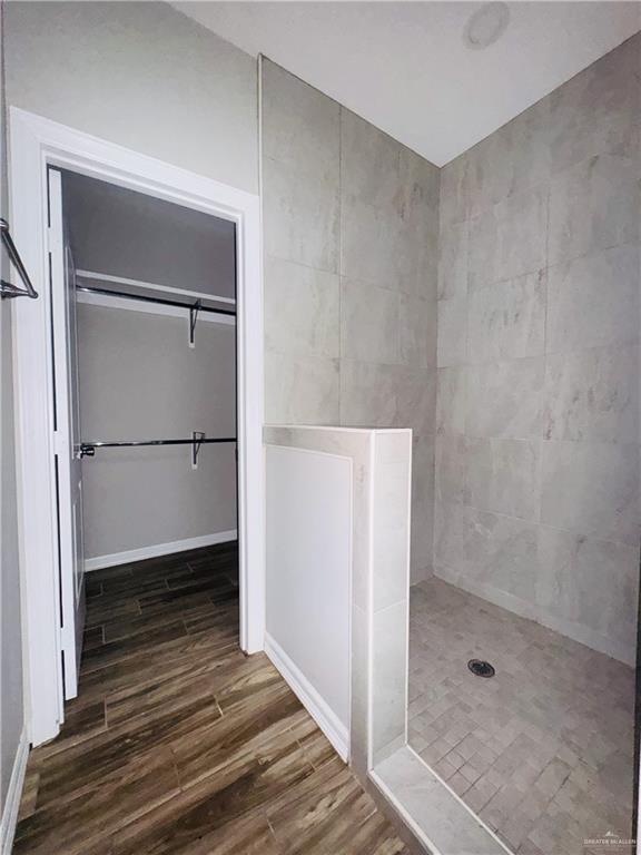 812 Kentucky Street, Unit 1 Mission, TX 78573 - Photo 11 of 18 a bathroom with a glass shower door