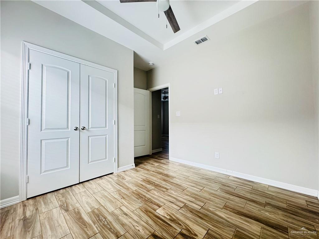 812 Kentucky Street, Unit 1 Mission, TX 78573 - Photo 16 of 18 a view of an empty room with wooden floor