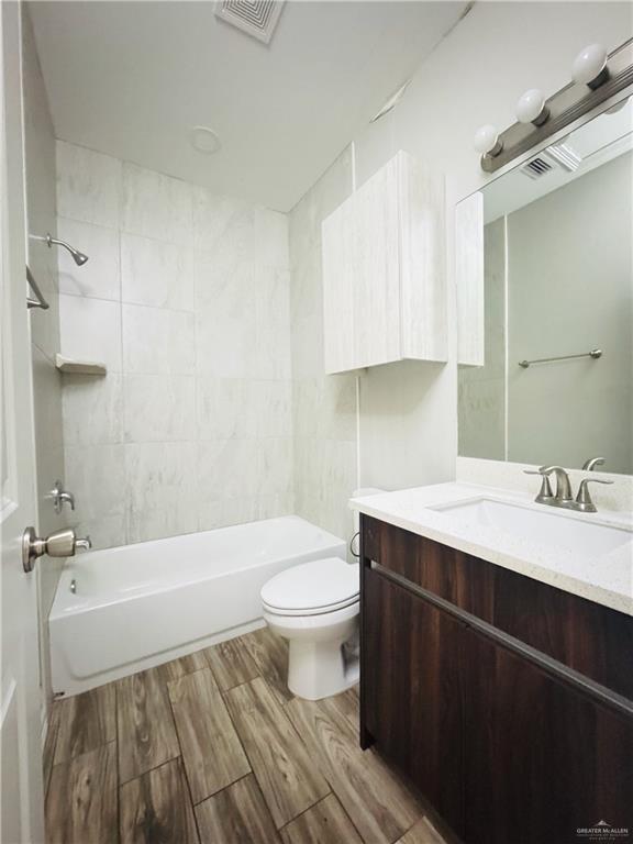 812 Kentucky Street, Unit 1 Mission, TX 78573 - Photo 18 of 18 a bathroom with a sink a toilet and a bathtub
