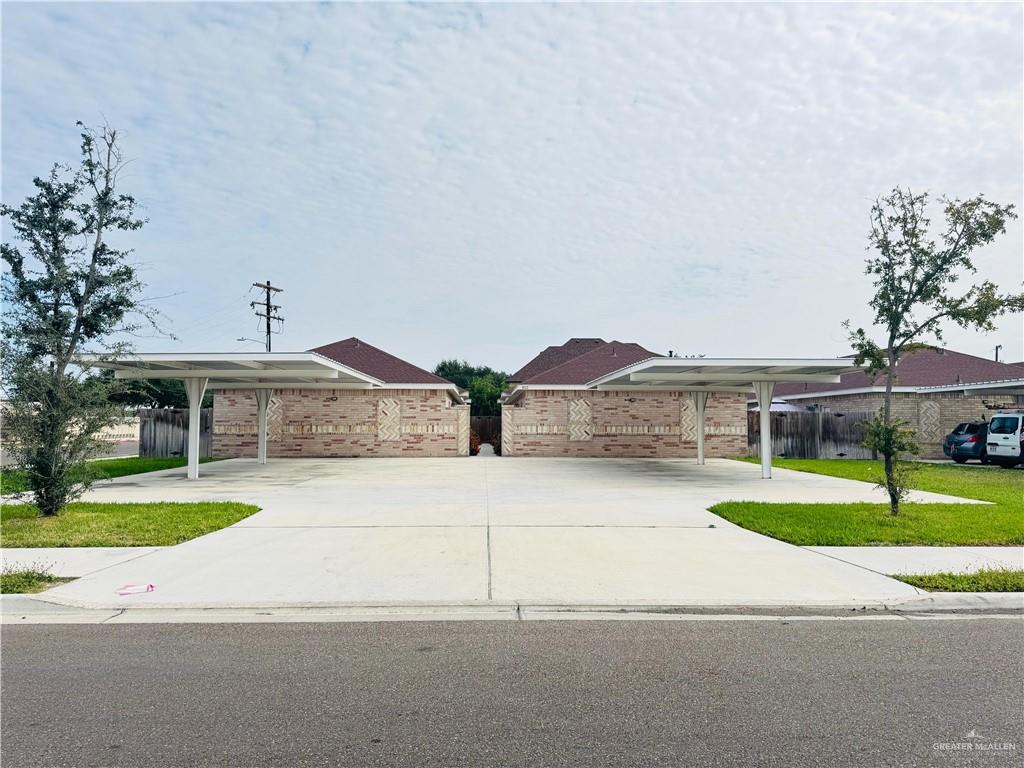 812 Kentucky Street, Unit 1 Mission, TX 78573 - Photo 2 of 18 a front view of house with yard and green space