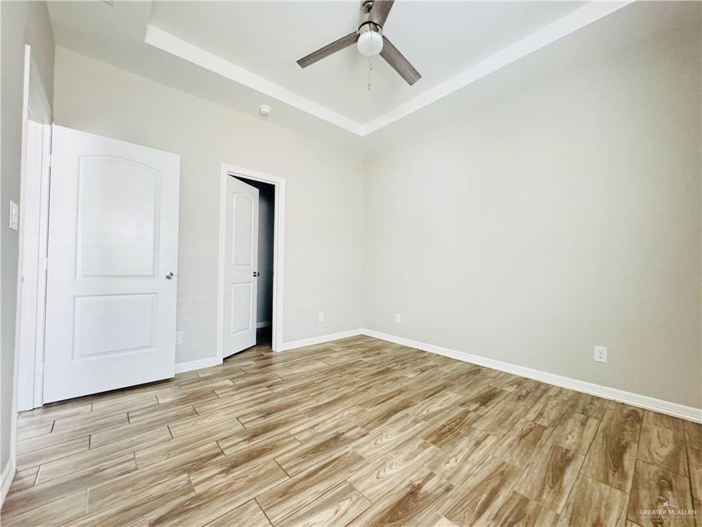 812 Kentucky Street, Unit 1 Mission, TX 78573 - Photo 10 of 18 a view of empty room with wooden floor