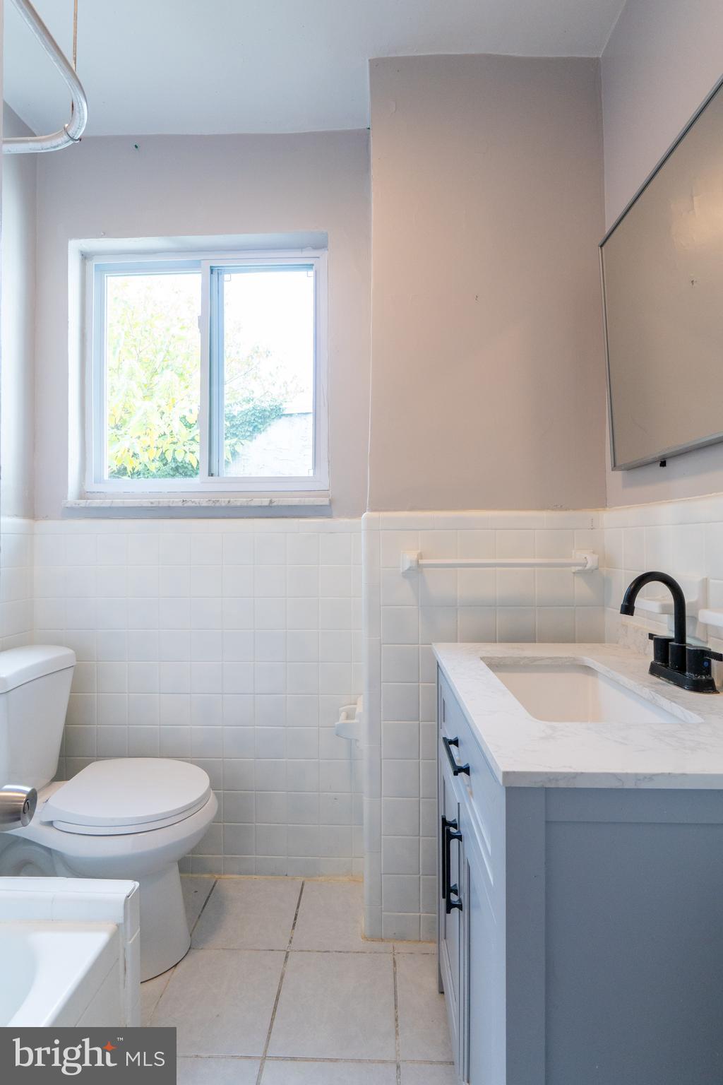 1826 McClellan Street Philadelphia, PA 19145 - Photo 14 of 22 a bathroom with a sink toilet and mirror