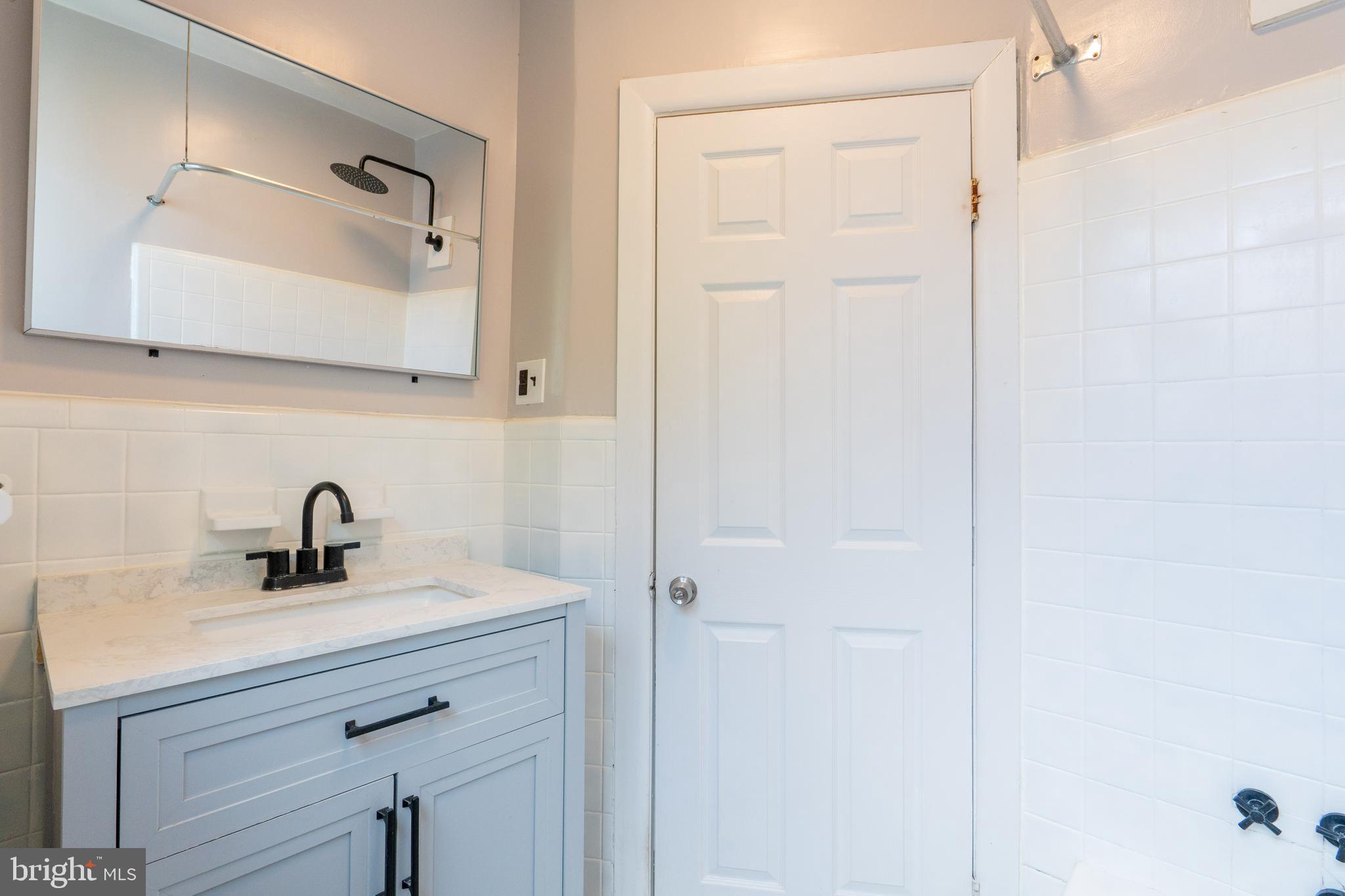 1826 McClellan Street Philadelphia, PA 19145 - Photo 15 of 22 a bathroom with a sink and a mirror