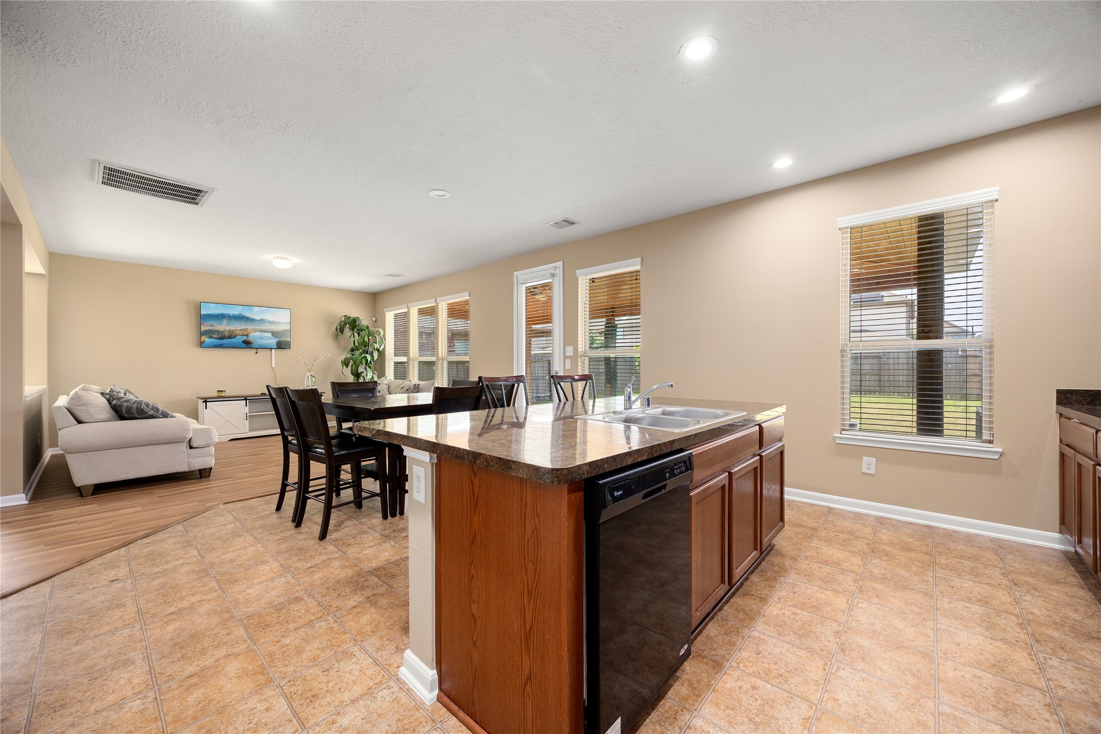 22414 Bellwick Ridge Lane Katy, TX 77449 - Photo 6 of 23 Functional kitchen featuring ample cabinet and counter space with an open flow to the main living areas.
