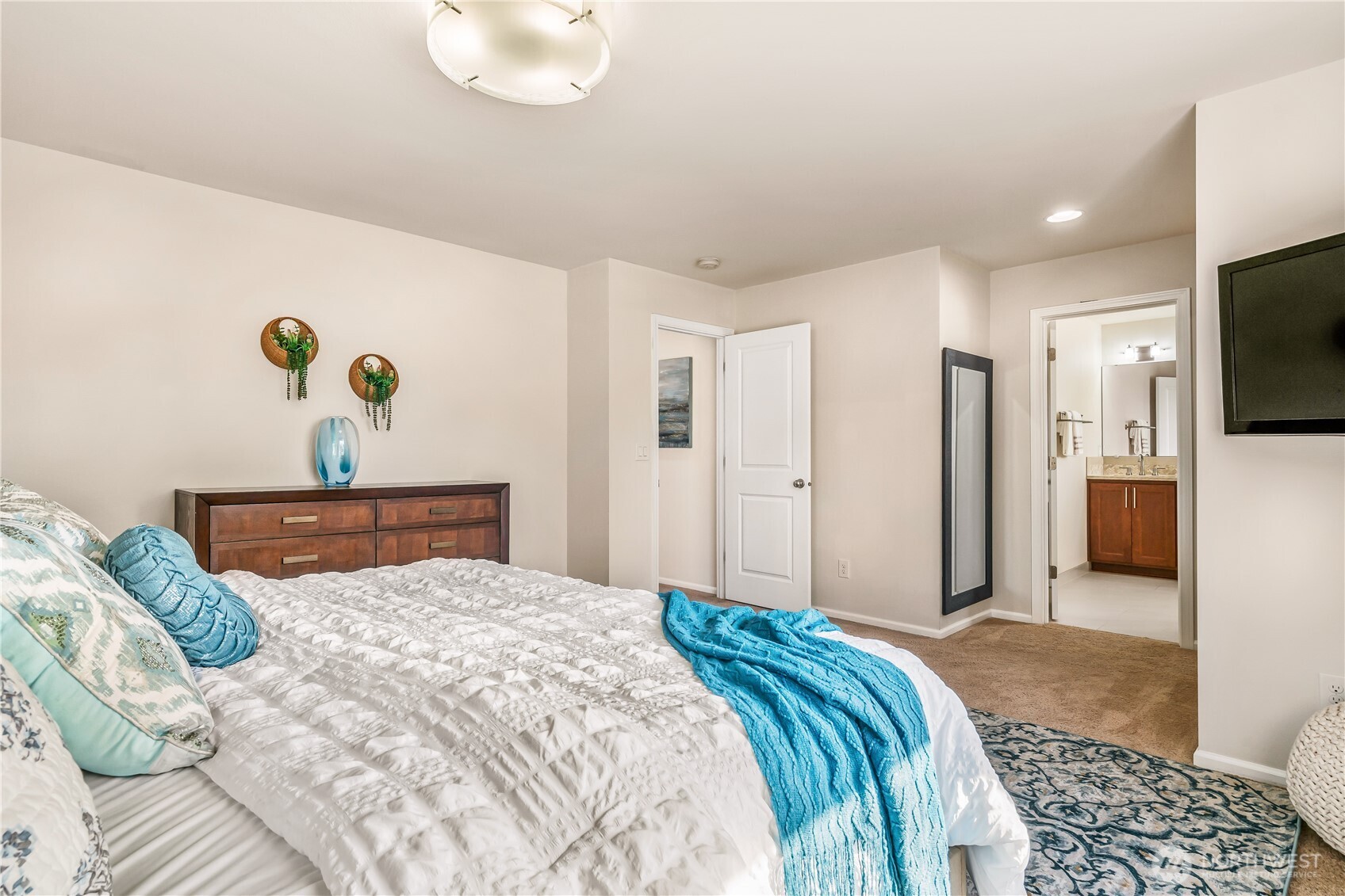 17712 39th Drive Southeast Bothell, WA 98012 - Photo 19 of 40 a bedroom with a bed and flat screen tv