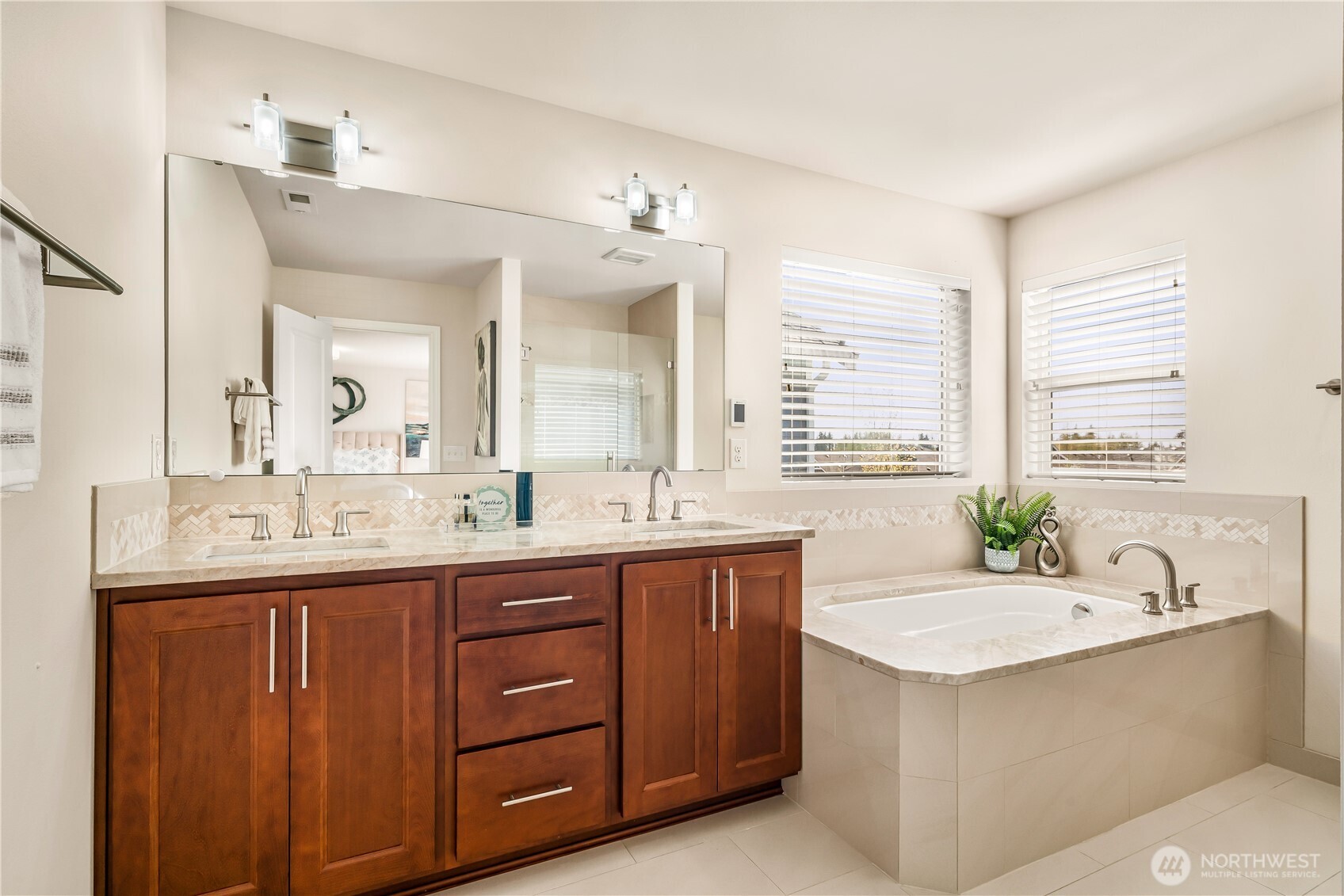 17712 39th Drive Southeast Bothell, WA 98012 - Photo 20 of 40 a bathroom with a granite countertop sink and a bathtub