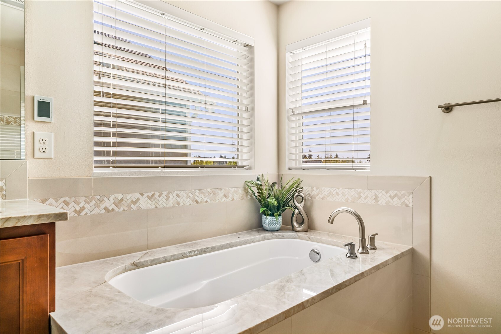 17712 39th Drive Southeast Bothell, WA 98012 - Photo 21 of 40 a bathroom with bathtub and window