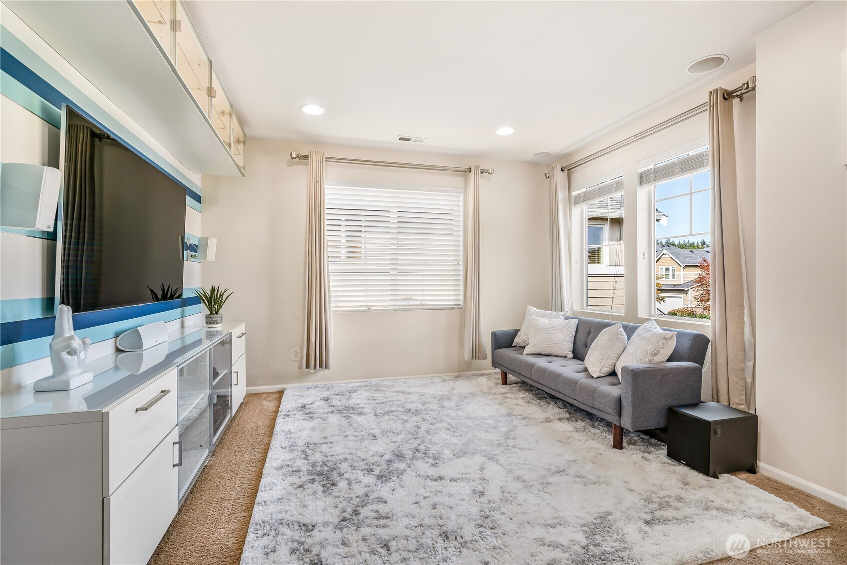 17712 39th Drive Southeast Bothell, WA 98012 - Photo 24 of 40 a spacious bedroom with a large bed and a flat screen tv
