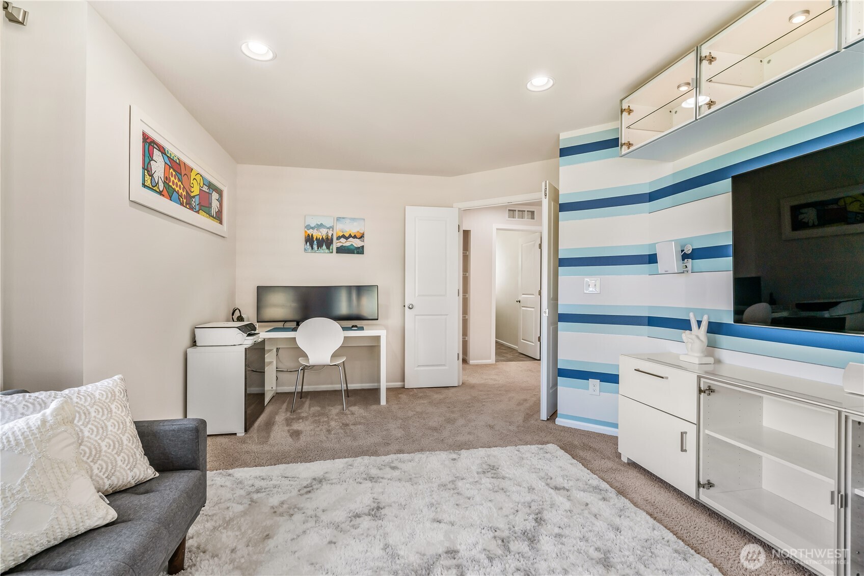 17712 39th Drive Southeast Bothell, WA 98012 - Photo 26 of 40 a living room with furniture and a flat screen tv