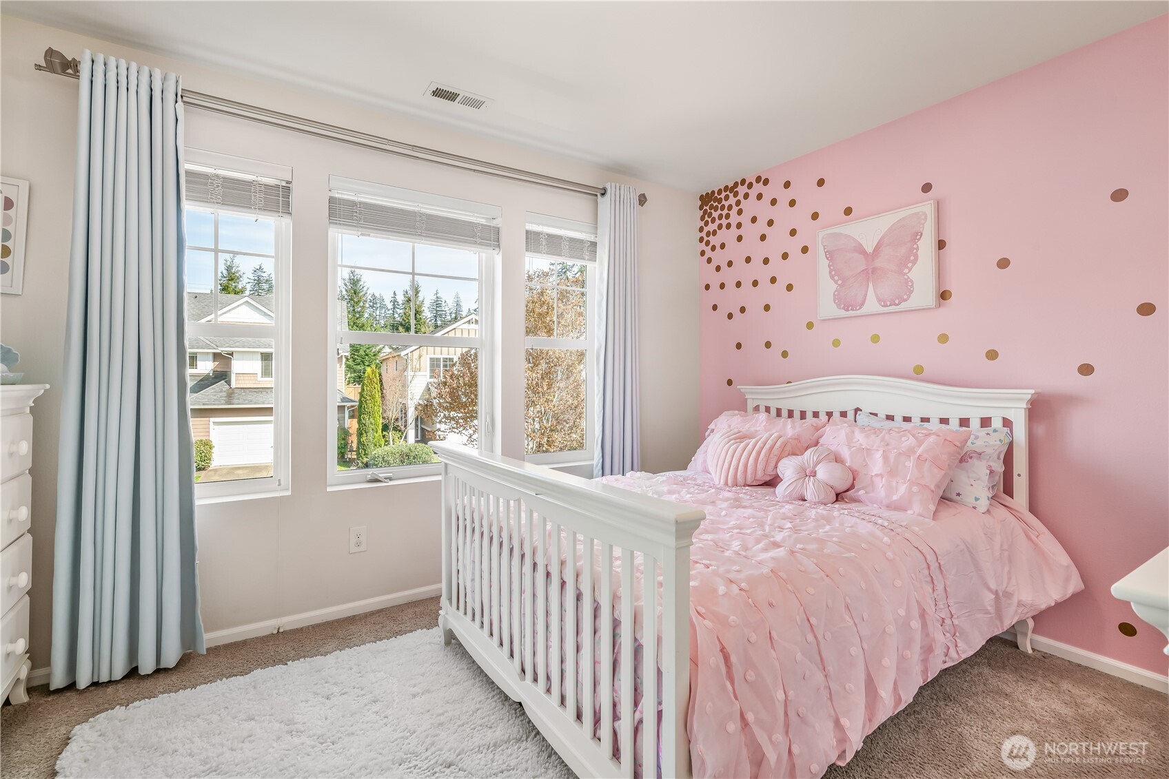 17712 39th Drive Southeast Bothell, WA 98012 - Photo 29 of 40 a bedroom with a large bed and a window