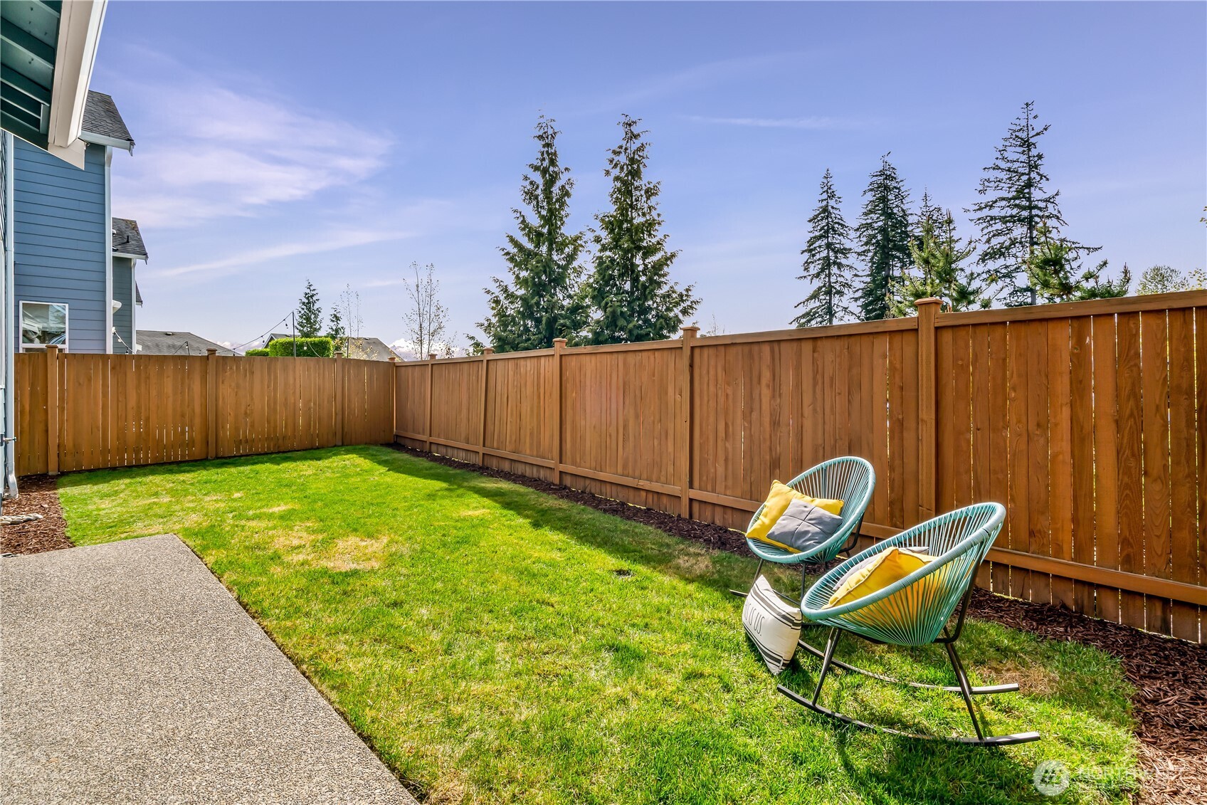 17712 39th Drive Southeast Bothell, WA 98012 - Photo 32 of 40 a backyard of a house with table and chairs