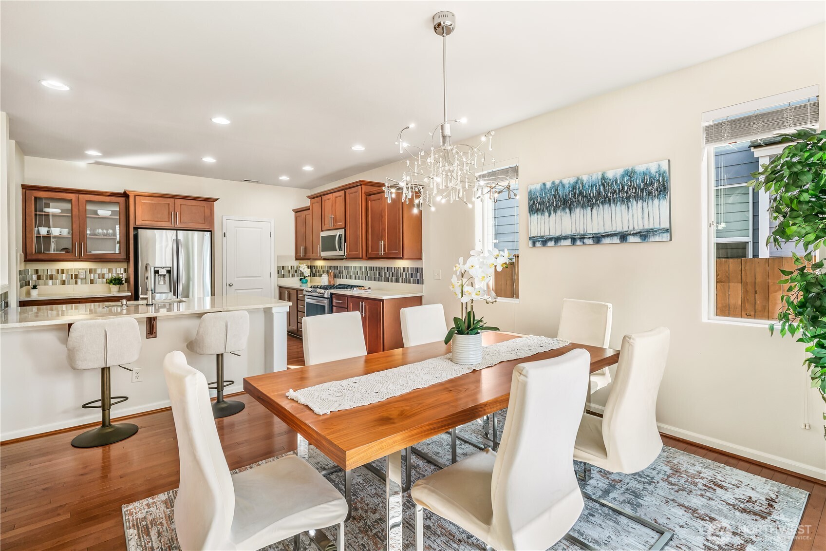 17712 39th Drive Southeast Bothell, WA 98012 - Photo 10 of 40 a view of a dining room with furniture window and wooden floor