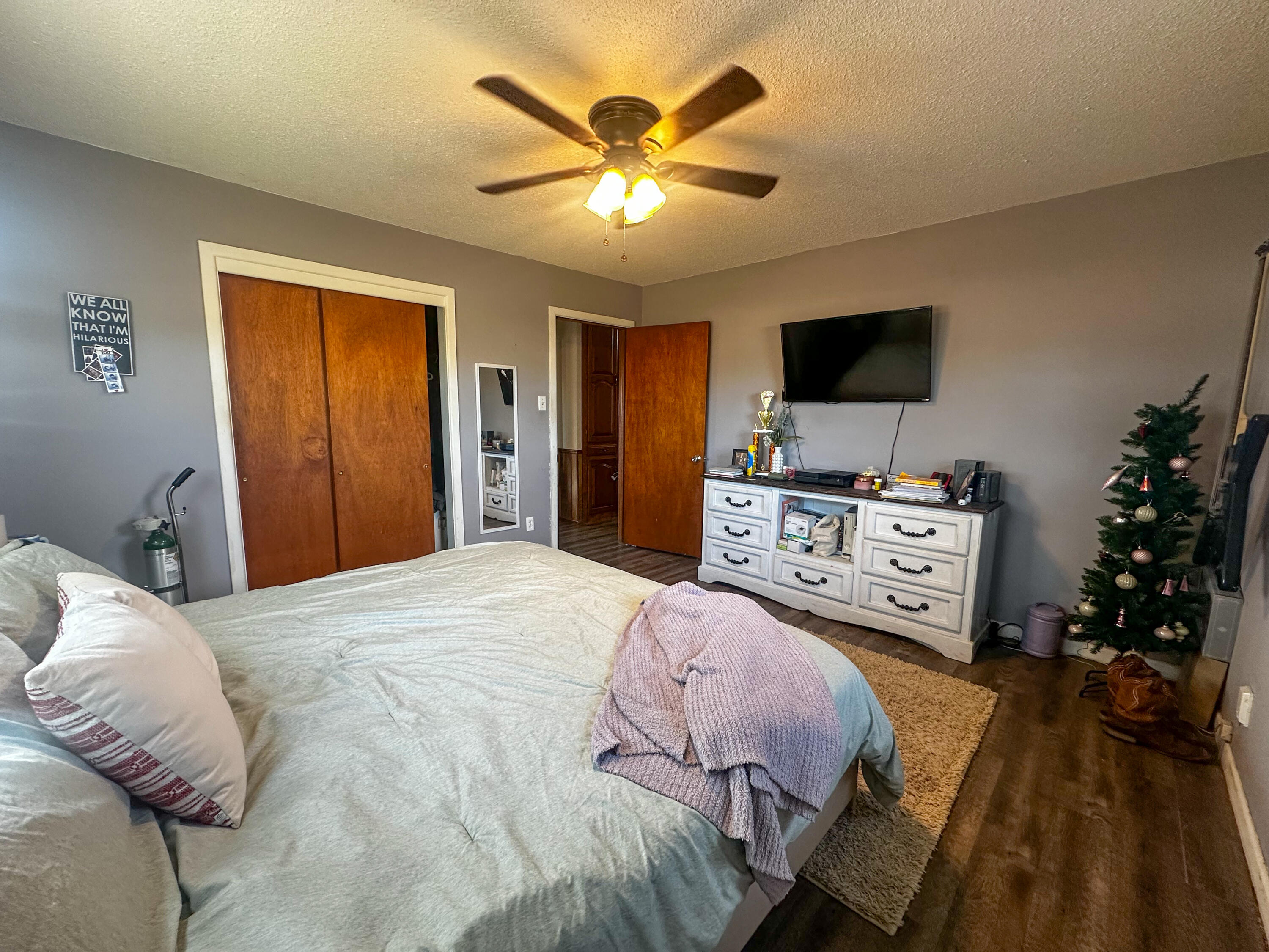 511 Childress Avenue Turkey, TX 79261 - Photo 11 of 20 a bedroom with a bed and a flat screen tv