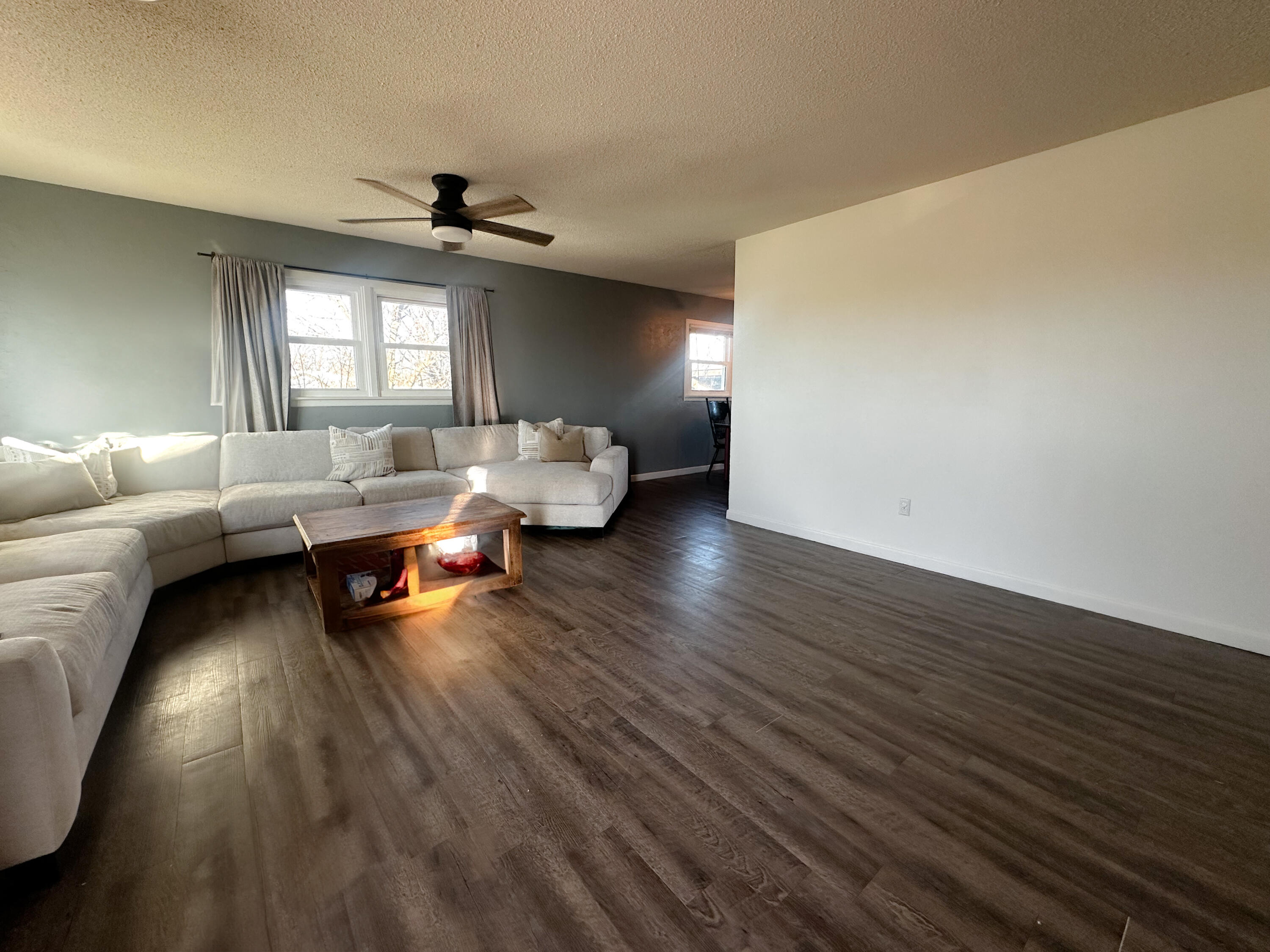 511 Childress Avenue Turkey, TX 79261 - Photo 3 of 20 a living room with furniture and a wooden floor