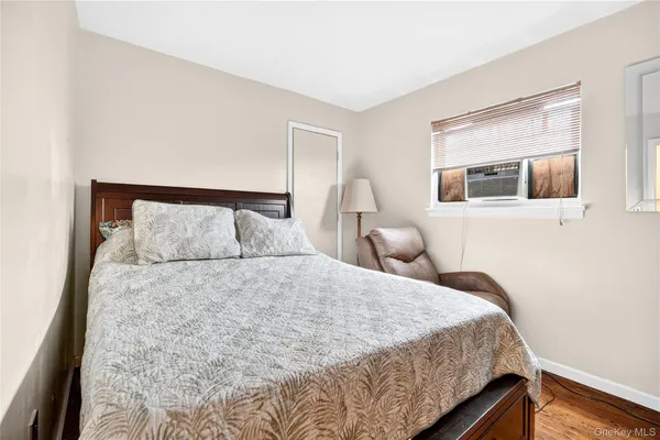 a bedroom with a large bed and a tv