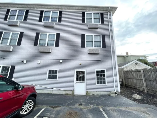 a front view of a house with parking space