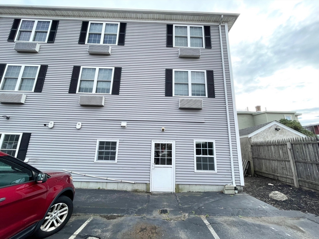 12 Pratt Street, Unit 105A Mansfield, MA 02048 - Photo 2 of 20 a front view of a house with parking space