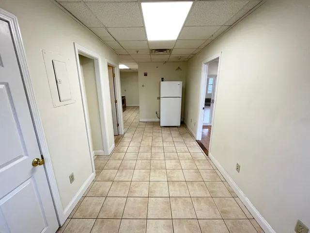 a view of an empty room and a hallway