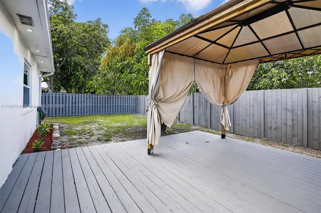 a view of outdoor space and wooden deck