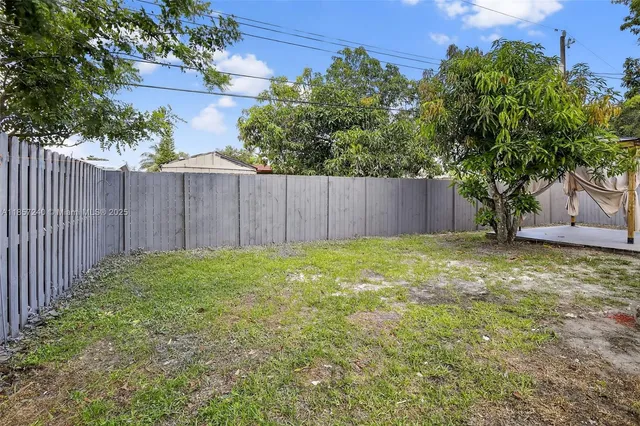 a view of backyard with tree