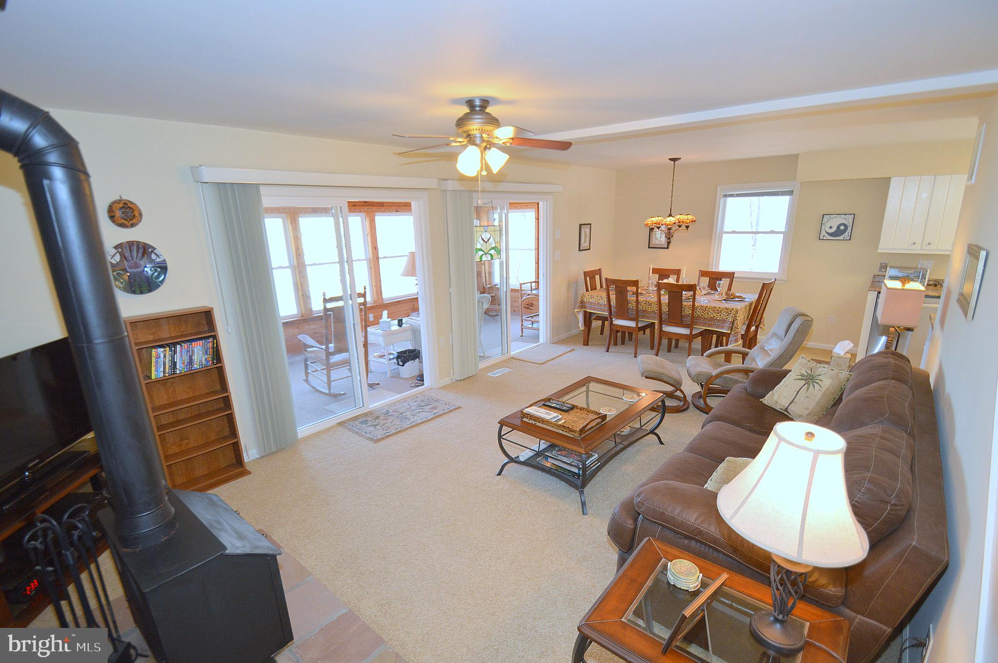 671 Razorback Ridge Road Great Cacapon, WV 25422 - Photo 15 of 35 Livingroom with wood stove.