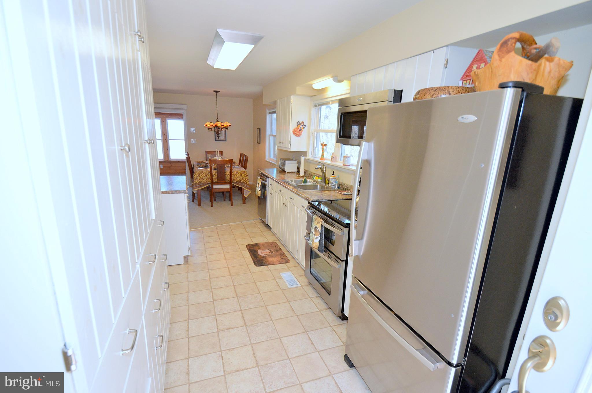 671 Razorback Ridge Road Great Cacapon, WV 25422 - Photo 6 of 35 Kitchen with generous amount of built in cabinets.