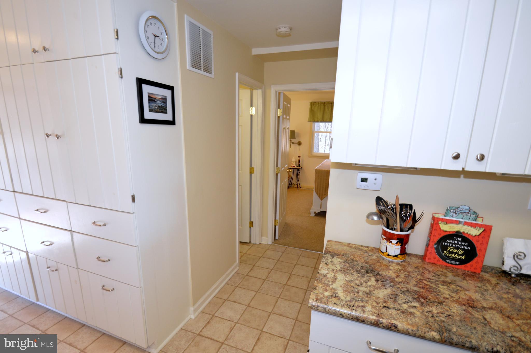 671 Razorback Ridge Road Great Cacapon, WV 25422 - Photo 8 of 35 Hallway from kitchen to bathroom and bedroom.
