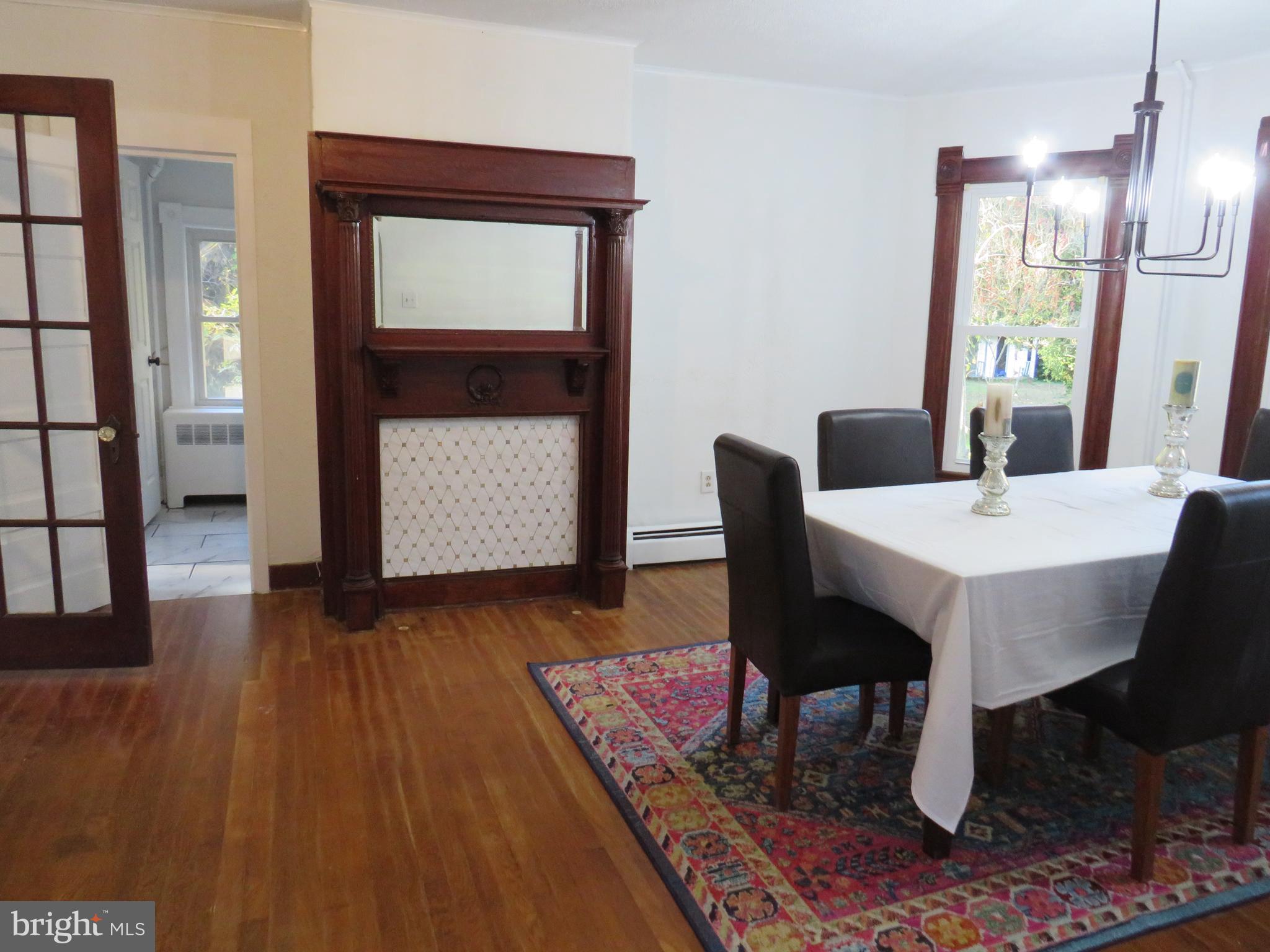 3372 Sackertown Road Crisfield, MD 21817 - Photo 11 of 29 a view of a dining room with furniture and wooden floor