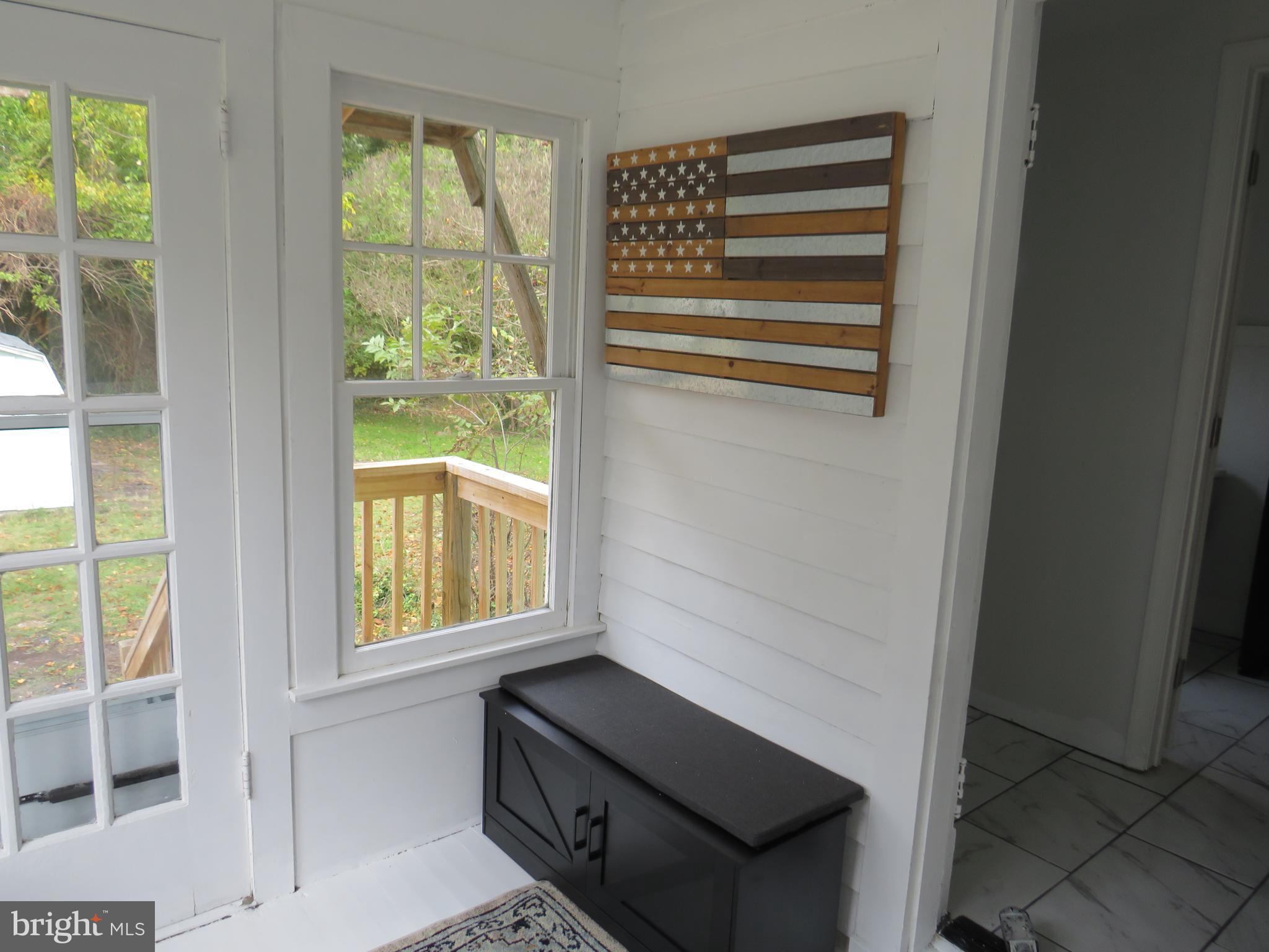 3372 Sackertown Road Crisfield, MD 21817 - Photo 12 of 29 a view of an empty room with a window