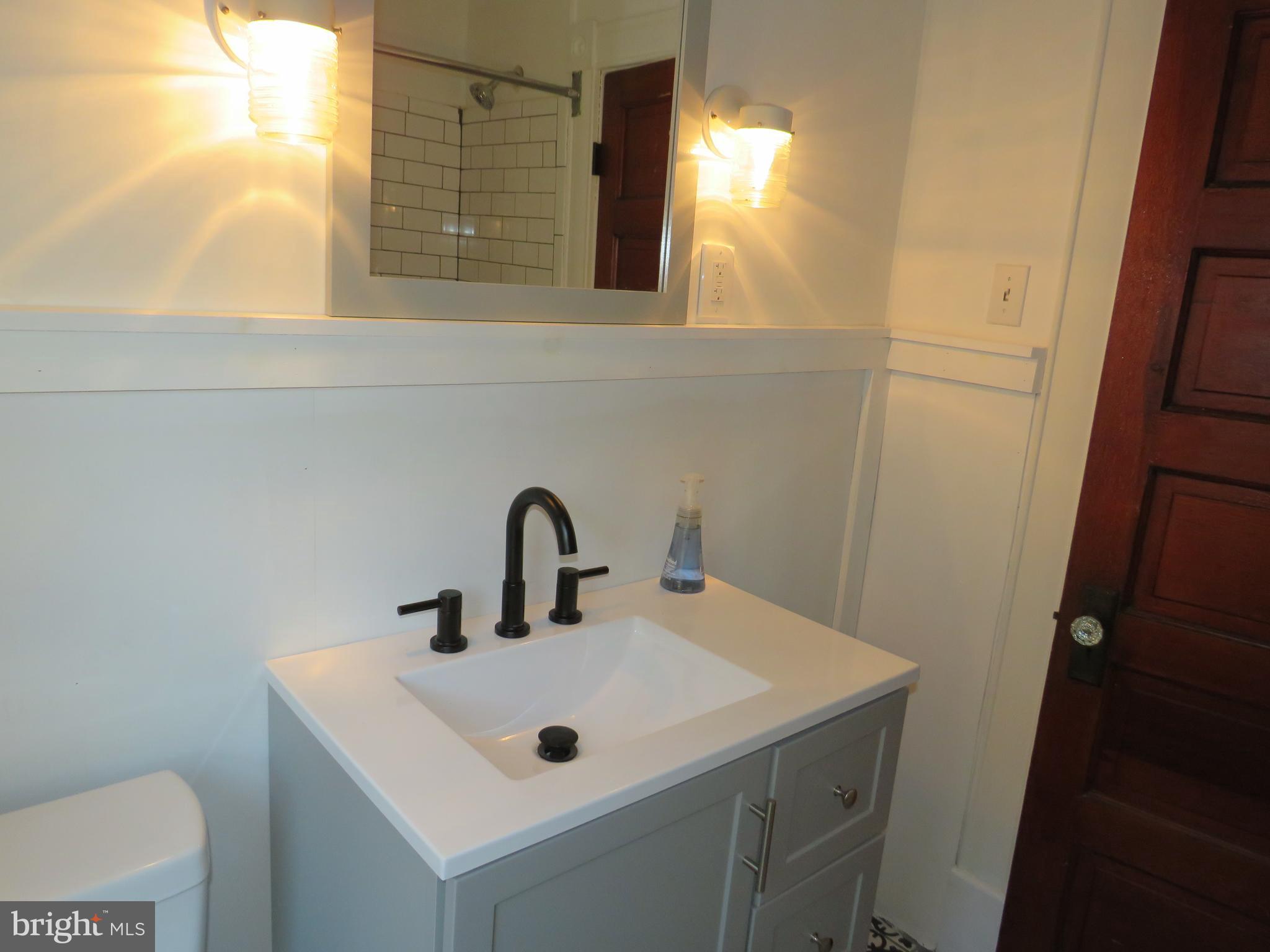 3372 Sackertown Road Crisfield, MD 21817 - Photo 21 of 29 a bathroom with a sink and a toilet